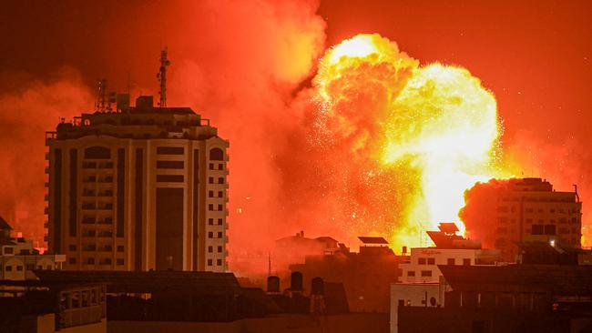 A fireball erupts from an Israeli airstrike in Gaza City on October 9, 2023.