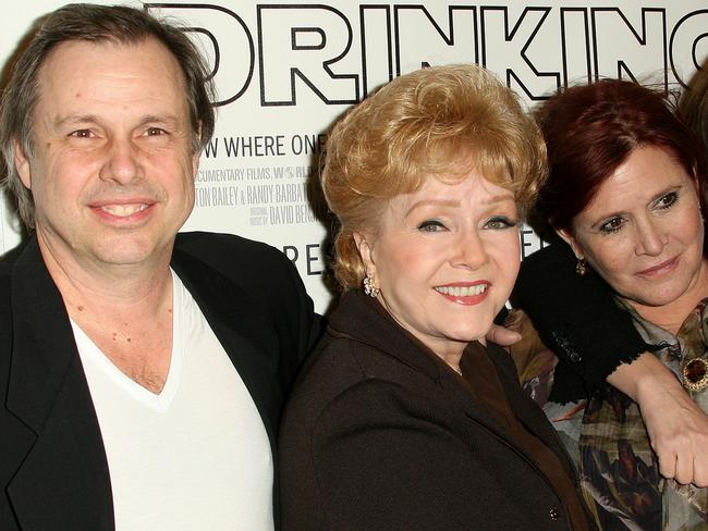 Todd Fisher pictured with his mum Debbie Reynolds and sister Carrie Fisher at the premiere of Wishful Drinking on December 7, 2010. Picture: AFP/Getty Images North America/Frederic M Brown