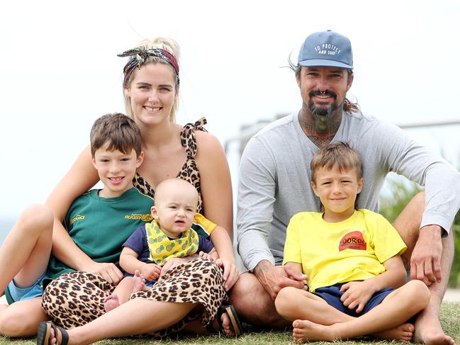 Matt Syron with partner Brooke and their children Chayce, 9, Vallen, 6, and 9-month-old Maynard. Matt saved teenager Caleb Wright from drowning two months ago. Picture: Tim Hunter