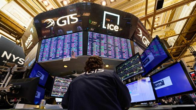 Traders work on the floor of the New York Stock Exchange as banking shares faced a fresh hammering. Picture: AFP.