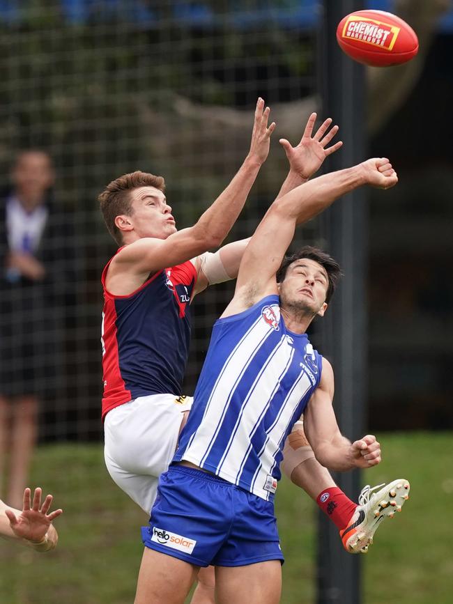 Bayley Fritsch flies for a mark over Robbie Tarrant. Picture: AAP Image/Michael Dodge