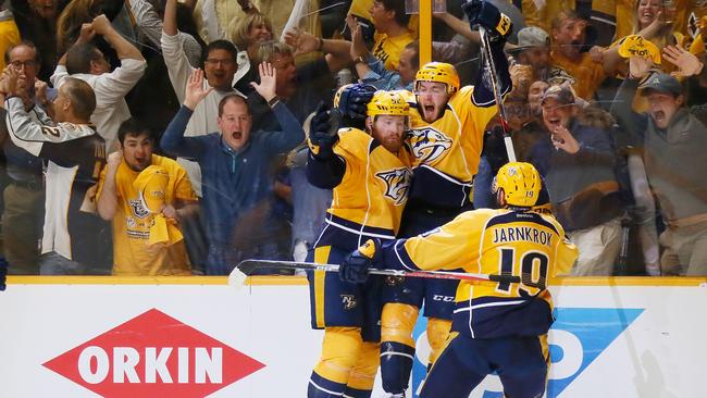 Colton Sissons #10 of the Nashville Predators celebrates with teammates after scoring during the third period.