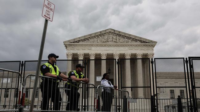 US Capitol Police officers observe an abortion rights rally in front of the US Supreme Court building on May 05, 2022 in Washington, DC. Protesters on both sides of the abortion debate. Picture; AFP.