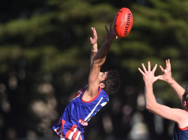 SFLfootball Springvale Districts v Keysborough at Springvale Reserve. Keysborough #13 Matthew Collett flies high.  Picture: Chris Eastman