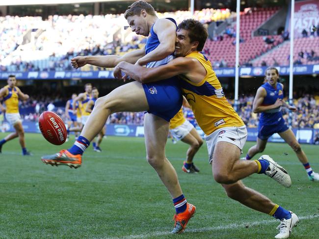 Andrew Gaff runs down Lachie Hunter. Picture: Michael Klein