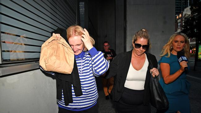 Maree Mavis Crabtree tries to cover her face from the media after she left court while on bail. Picture: NCA NewsWIRE / John Gass