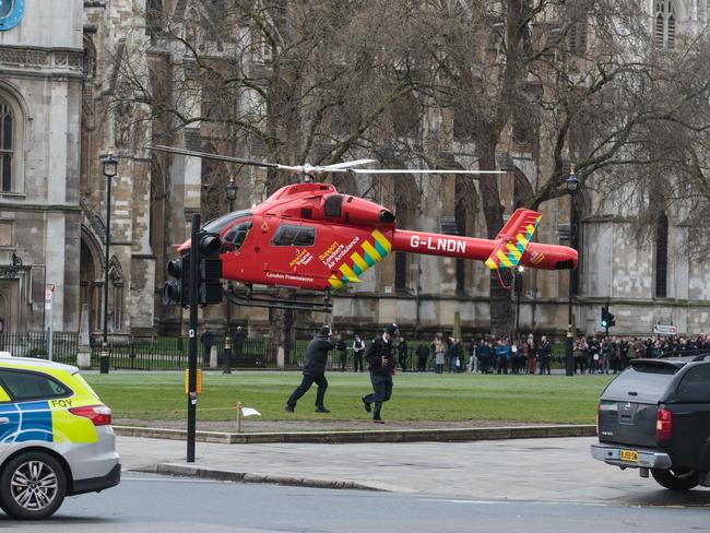 An Air Ambulance at the scene by Westminster Bridge and the Houses of Parliament in London following the attack.