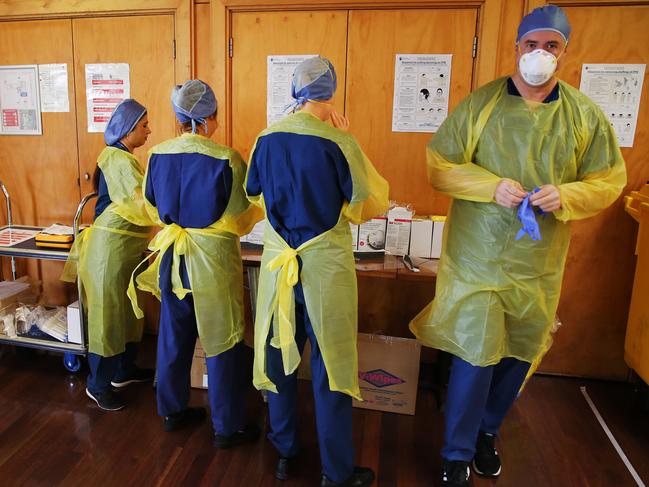 Staff at the mobile coronavirus clinic prepare to begin testing today. Picture Rohan Kelly