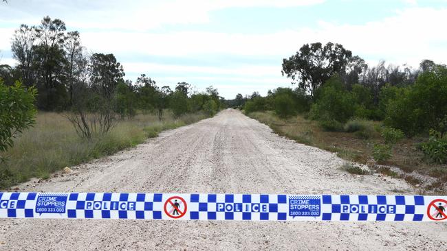 The road leading into Wains Road at Wieambilla is guarded by police. Picture: David Clark NCA/Newswire