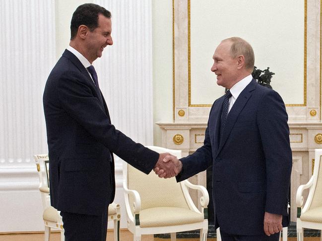 TOPSHOT - Russian President Vladimir Putin meets with Syrian President Bashar al-Assad at the Kremlin in Moscow on September 13, 2021. (Photo by Mikhail KLIMENTYEV / SPUTNIK / AFP)