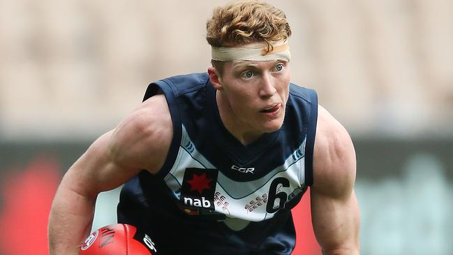 MELBOURNE, AUSTRALIA - JUNE 01: A bandaged up Matthew ROWELL of Vic Metro runs with the ball during the U18s match between Vic Metro and Vic Country at Melbourne Cricket Ground on June 01, 2019 in Melbourne, Australia. (Photo by Michael Dodge/Getty Images)