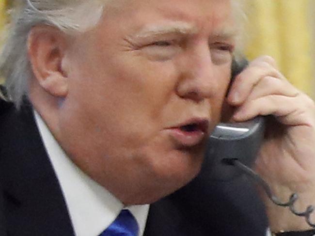 In this photo taken Jan. 28, 2017, President Donald Trump speaks on the phone with Australian Prime Minister Malcolm Turnbull in the Oval Office of the White House in Washington. Transcripts of President Donald Trumpâ€™s conversations with the leaders of Mexico and Australia in January offer new details on how the president parried with the leaders over the politics of the border wall and refugee policy, with random asides on subjects including drug abuse in New Hampshire. (AP Photo/Alex Brandon)