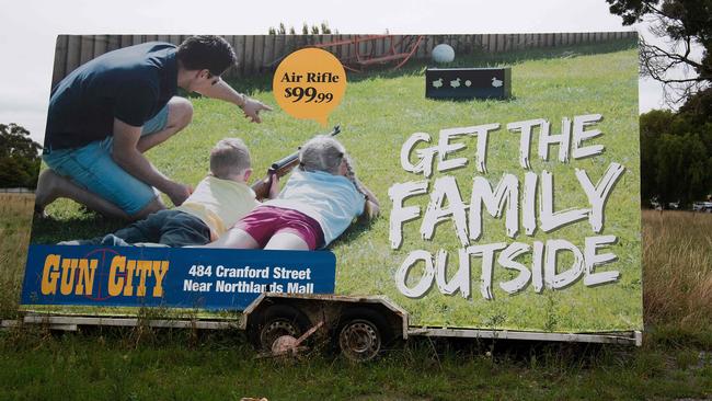 An advertisement for the Gun City store that has reportedly upset locals is seen on the outskirts of Christchurch. Picture: Marty Melville / AFP