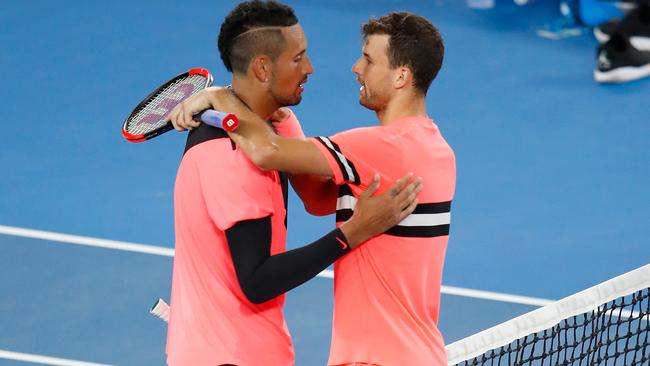 Nick Kyrgios and Grigor Dimitrov embrace after their fourth round match.