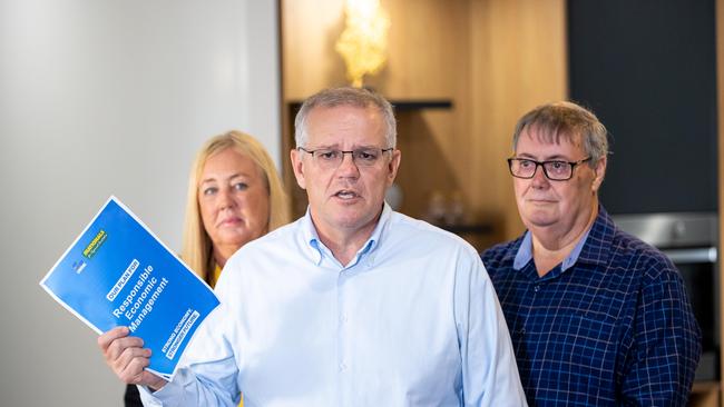 Mr Morrison cut a presser short in Brisbane and then relied on a prop while taking questions in Darwin this morning. Picture: Jason Edwards