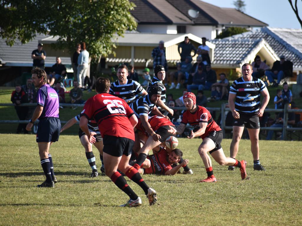 Louis Hollman delivers a pass for Wollongbar Alstonville