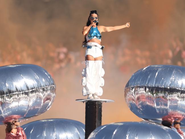 Katy Perry is lifted high above the stage and her dancers mid-show. Picture: Getty Images