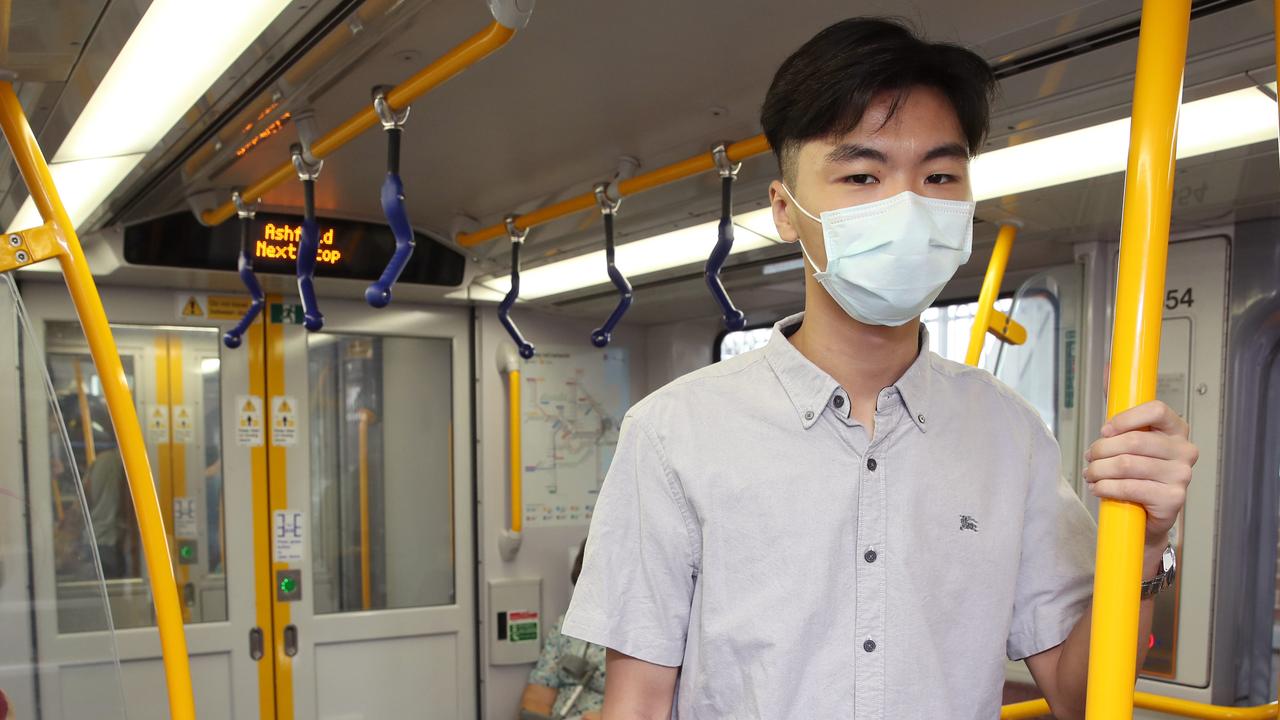 More and more commuters like Calvin Xiao, from Croydon, are wearing face masks. Picture: David Swift