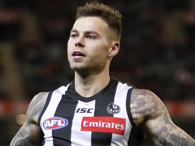 MELBOURNE, AUSTRALIA - AUGUST 23: Jamie Elliott of the Magpies celebrates a goal during the 2019 AFL round 23 match between the Collingwood Magpies and the Essendon Bombers at the Melbourne Cricket Ground on August 23, 2019 in Melbourne, Australia. (Photo by Dylan Burns/AFL Photos via Getty Images)