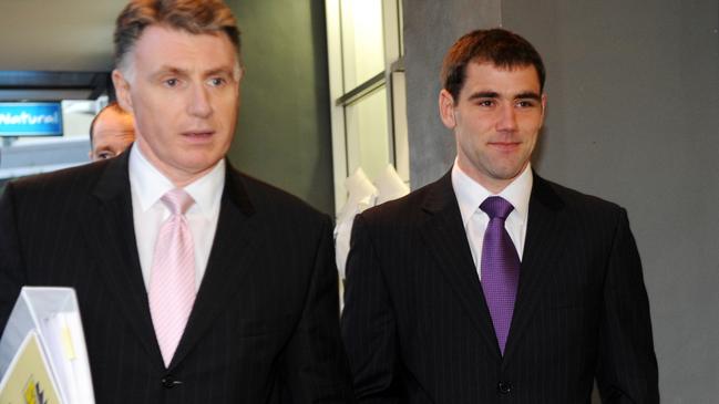 Melbourne Storm captain Cameron Smith (right) arrives at the NRL judiciary to contest a dangerous tackle charge in 2008. Picture: AAP Image