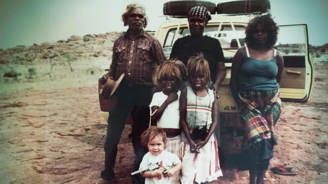 As a toddler (front) near the country Nampijinpa Price’s grandfather was born on - Juka Juka, the desert around Yuendumu - with family. Picture: Courtesy of Jacinta Nampijinpa Price