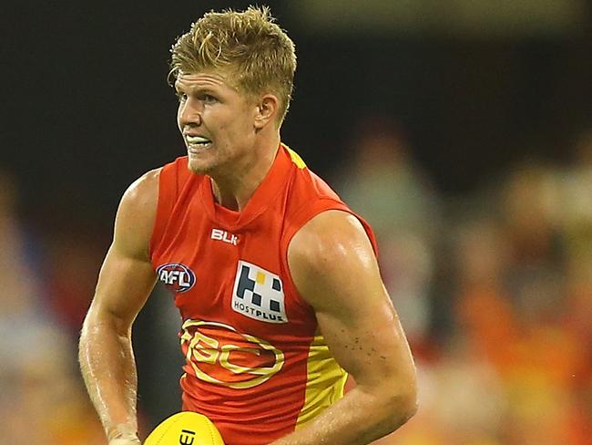 GOLD COAST, AUSTRALIA - MAY 02: Josh Glenn of the Suns runs the ball during the round five AFL match between the Gold Coast Suns and the Brisbane Lions at Metricon Stadium on May 2, 2015 in Gold Coast, Australia. (Photo by Chris Hyde/Getty Images)