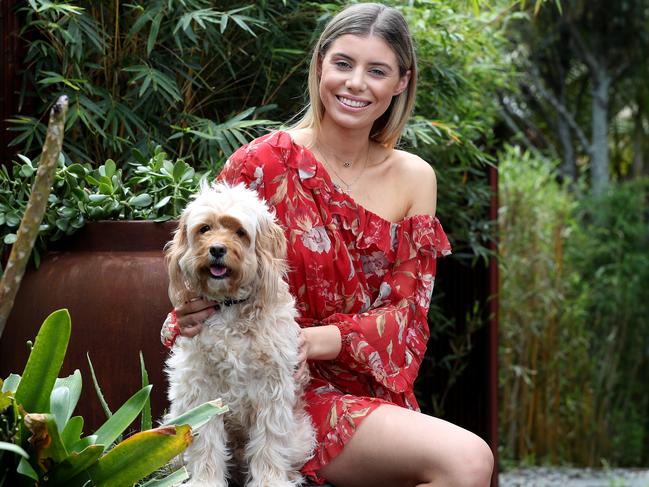 Paris Vougdis, 21, pictured with her dog Charlie, is looking for a Greek Orthodox man to date. Picture: David Swift