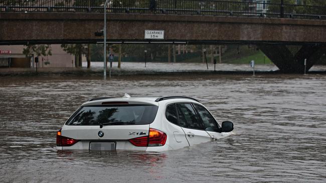 The car stuck in the Parramatta River on Sunday afternoon. Picture: Adam Yip