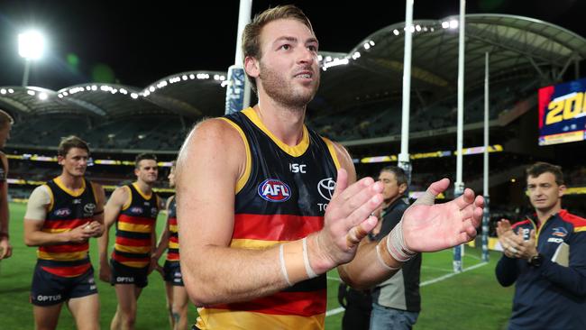 Adelaide's Daniel Talia leads the team off in his 200th game Picture: Sarah Reed