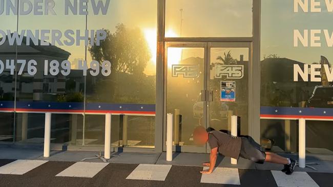 Jamie does a push up outside his shut down gym. Picture: news.com.au