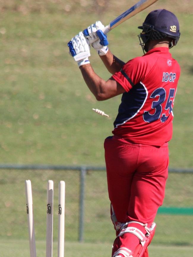 Melbourne's Jackson Koop is bowled.