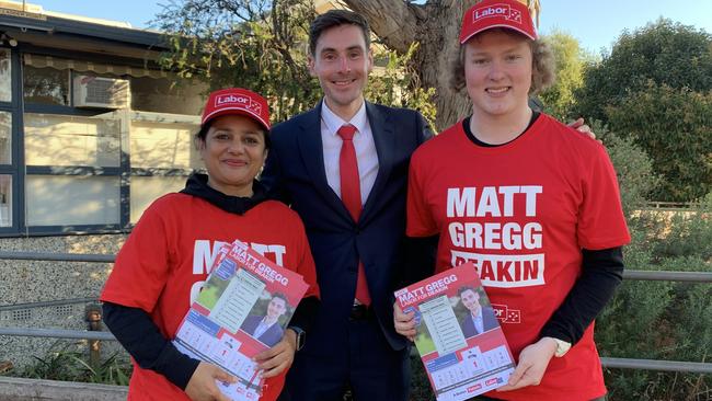 ALP candidate for Deakin Matt Gregg, middle, with campaign volunteers Nildhara Gadani and Adam Rae at Vermont Secondary College on federal election day 2022. Picture: Kirra Grimes