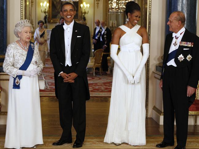 (FILES) In this file photo taken on May 24, 2011 Britain's Queen Elizabeth II (L) and US President Barack Obama (2ndL) pose with US First Lady Michelle Obama (2ndR) and Prince Philip (R), Duke of Edinburgh, in the Music Room of Buckingham Palace ahead of a State Banquet on May 24, 2011 in London, England. - Queen Elizabeth II's 99-year-old husband Prince Philip, who was recently hospitalised and underwent a successful heart procedure, died on April 9, 2021, Buckingham Palace announced. (Photo by - / POOL / AFP)