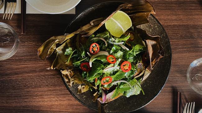 Turmeric and coconut roasted barramundi in banana leaf at Ong Vietnamese Kitchen. Picture: Supplied