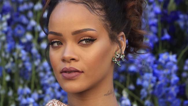 Singer Rihanna poses before Christian Dior's Spring-Summer 2016 ready-to-wear fashion collection to be presented during the Paris Fashion Week, in Paris, France, Friday, Oct. 2, 2015. (AP Photo/Thibault Camus)