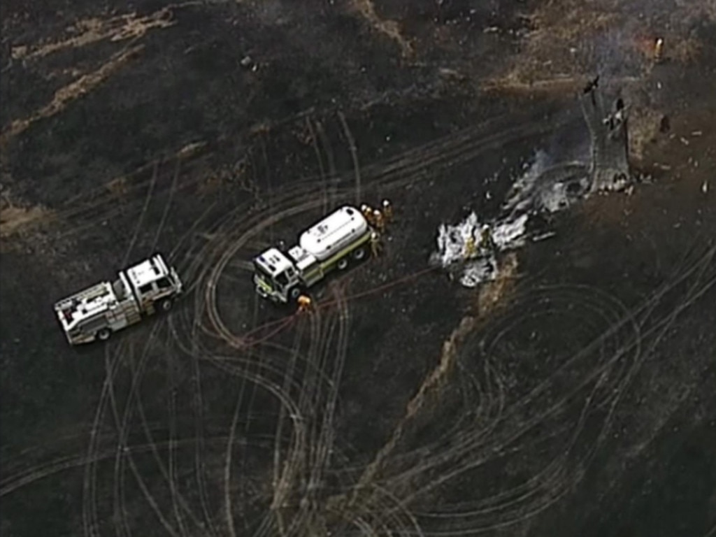 Fire crews remain on scene at a bushfire at Sampson Flat after the threat posed by the blaze was downgraded from a Watch and Act warning. Picture: 7NEWS