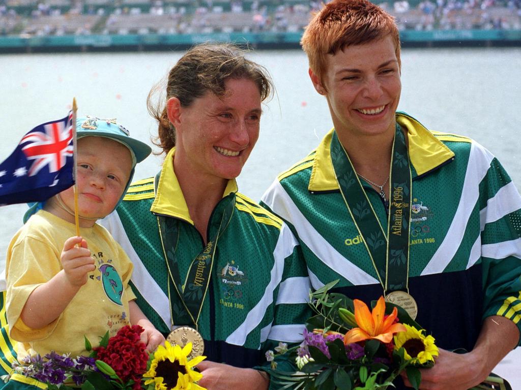 Anna Wood (with son Jordan) and Katrin Borchert after receiving their bronze medals for the women's K2 500m race today at the Atlanta Olympics.