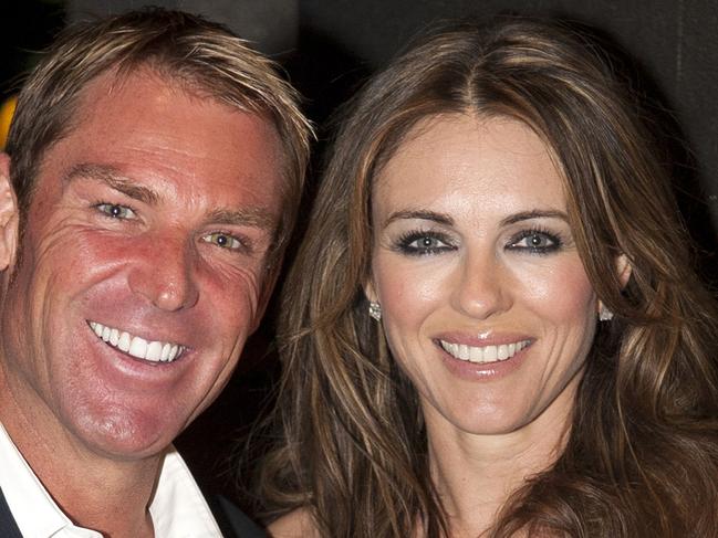 MUST CREDIT GETTY MELBOURNE, AUSTRALIA - OCTOBER 27: In this handout image provided by the Crown, Shane Warne and Elizabeth Hurley pose at Club 23 in Crown Casino on October 27, 2011 in Melbourne, Australia. (Photo by Dave Goudie-Eagle Image/Crown via Getty Images) aslipics