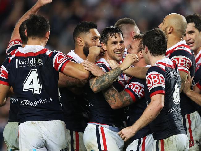 Roosters Mitchell Pearce celebrates with his team mates after scoring a try. Picture: Brett Costello