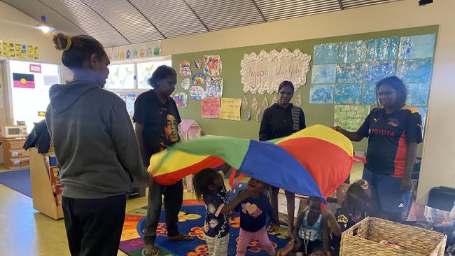 Willowra early child hood centre - Families and caregivers engage in learning games with the children. Picture: Supplied/ Central Land Council