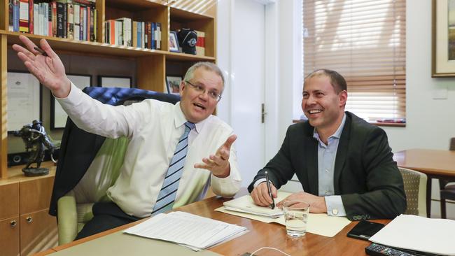 Prime Minister Scott Morrison and Treasurer Josh Frydenberg watch rugby league in the Treasuer’s office yesterday. Picture: Sean Davey