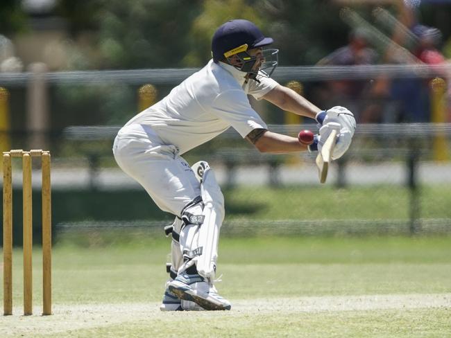 Dingley batsman Calvin Barlow reaches for a wide ball.