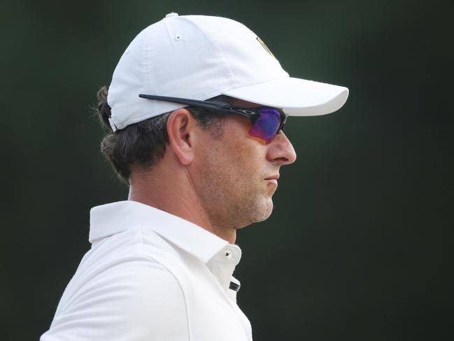 CHARLOTTE, NORTH CAROLINA - SEPTEMBER 24: Adam Scott of Australia and the International Team looks on from the 18th green during Saturday afternoon four-ball matches on day three of the 2022 Presidents Cup at Quail Hollow Country Club on September 24, 2022 in Charlotte, North Carolina.   Stacy Revere/Getty Images/AFP