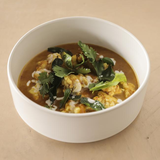 Coconut and turmeric curry of Moreton Bay bug, kafir lime leaf. Picture: Mark Cranitch.