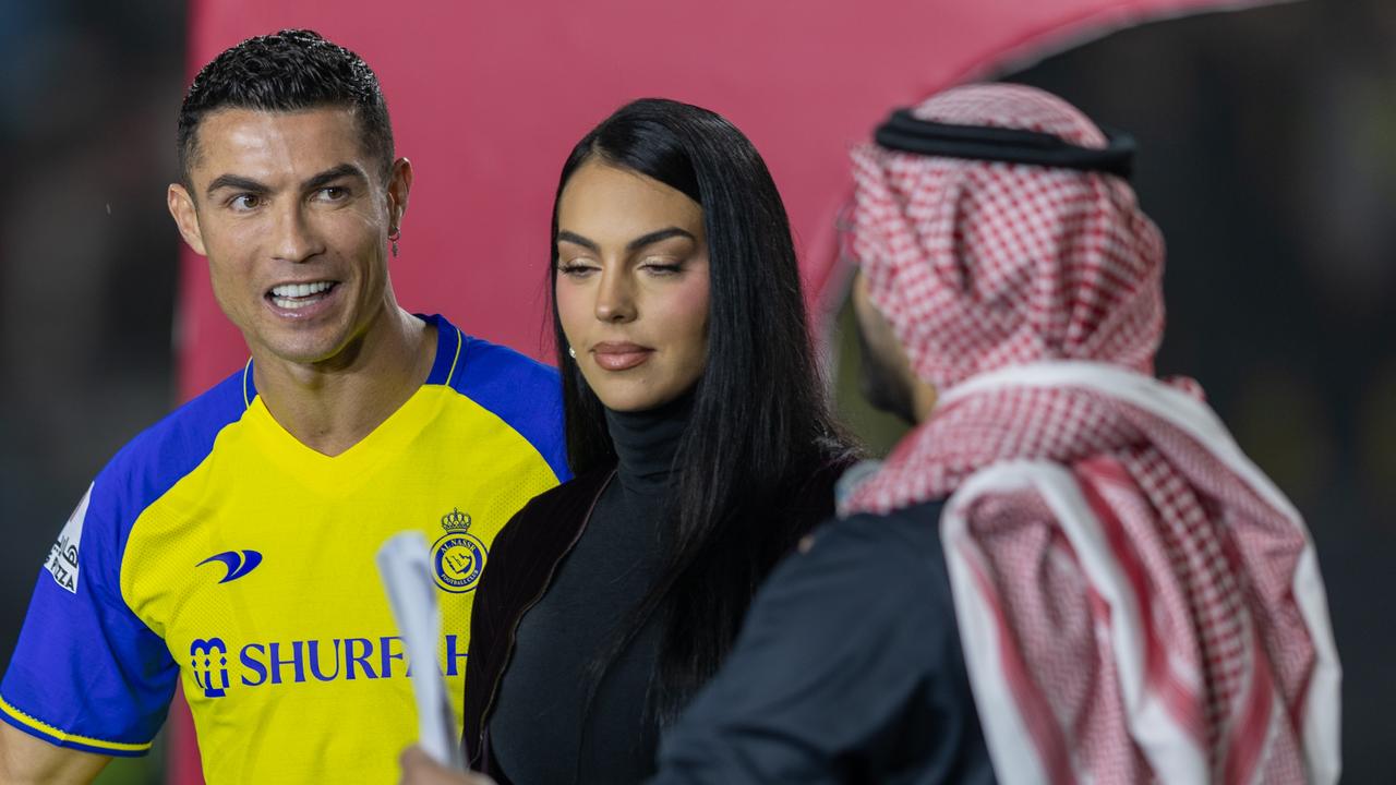 Cristiano Ronaldo accompanied by his partner Georgina Rodriguez greet the crowd during the official unveiling of Cristiano Ronaldo as an Al Nassr player at Mrsool Park Stadium. (Photo by Yasser Bakhsh/Getty Images)