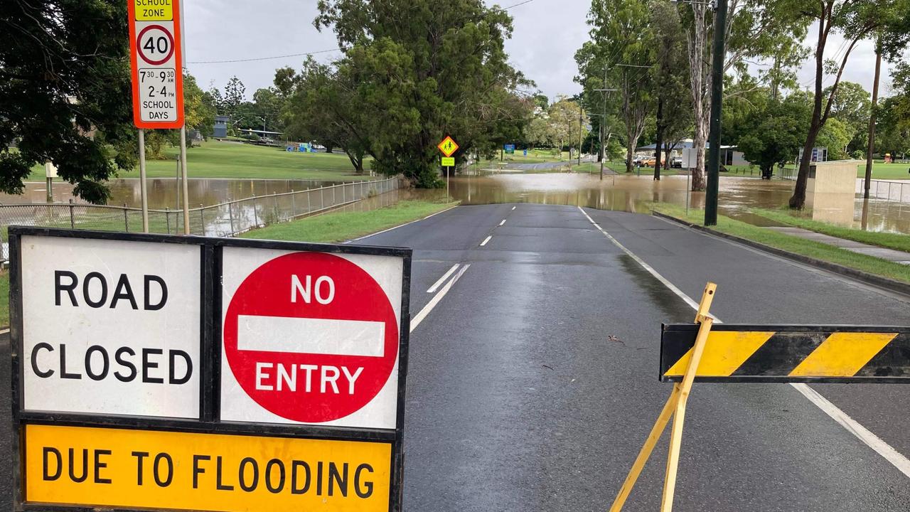 Floodwaters have cut Brisbane Rd at One Mile School. Photo: Scott Kovacevic.