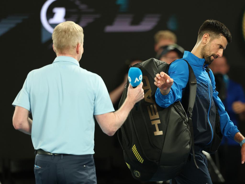 Novak Djokovic of Serbia leaves Rod Laver Arena after declining an on-court interview. Picture: Cameron Spencer/Getty Images)