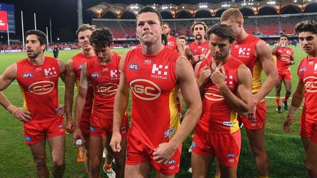 Steven May leads his players from the field after losing to Essendon.