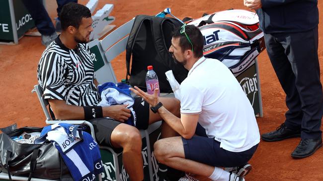 Jo-Wilfried Tsonga led 5-2 before pulling the plug against Ernests Gulbis.