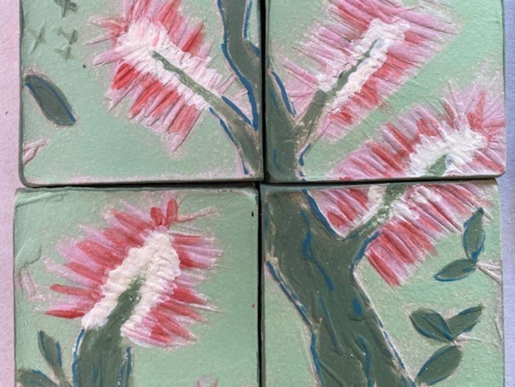 Handmade tiles curated by Stanthorpe High students who were inspired by the Stanthorpe Nine. Photo: SDRC